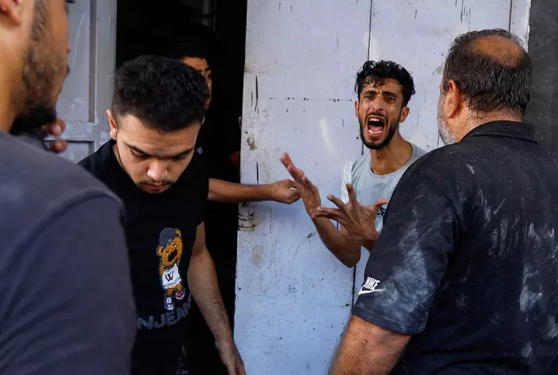 a man reacts at the site of an israeli strike on a house in khan younis in the southern gaza strip october 24 photo reuters