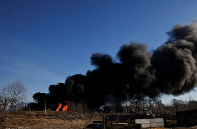 a column of smoke rises from burning fuel tanks that locals said were hit by five rockets at the vasylkiv air base following russia s invasion of ukraine outside kyiv ukraine march 12 2022 photo reuters a column of smoke rises from burning fuel tanks that locals said were hit by five rockets at the vasylkiv air base following russia s invasion of ukraine outside kyiv ukraine march 12 2022 photo reuters