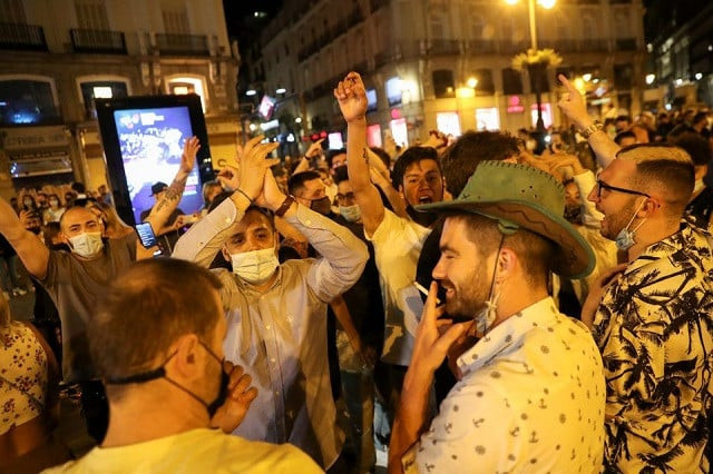 people celebrate as the state of emergency decreed by the spanish government to prevent the spread of the coronavirus disease covid 19 gets lifted at puerta del sol square in madrid spain may 9 2021 photo reuters
