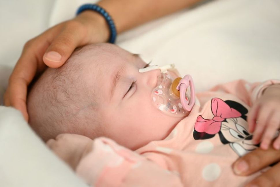 two month old spanish baby girl naiara who received a heart transplant in a pioneering surgery where doctors used a heart that had already stopped beating from a donor with a different blood type is seen in this handout picture released may 17 2021 by gregorio maranon hospital in madrid spain photo reuters