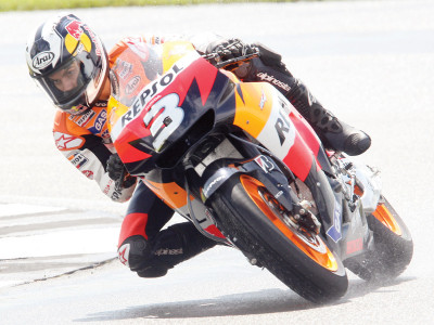 motorcycling pedrosa to race despite injury