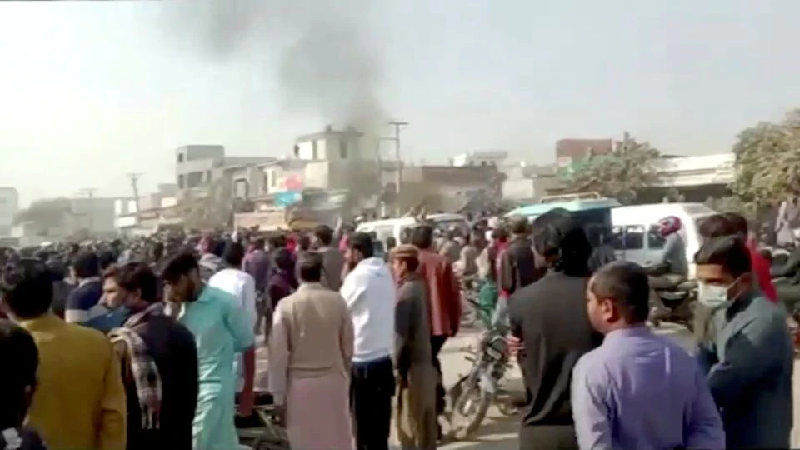 people gather after an attack on a factory in sialkot pakistan december 3 2021 photo reuters