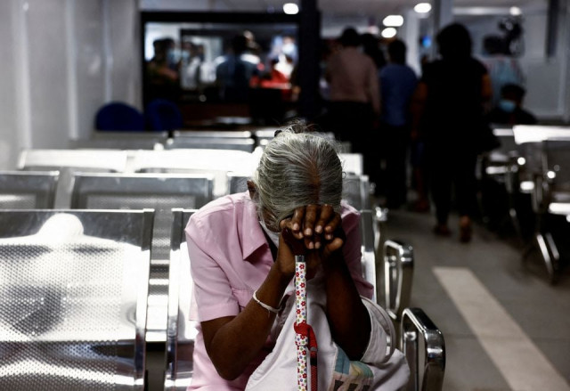 a woman waits to apply for a passport at the sri lanka s immigration and emigration department amid the country s economic crisis in colombo sri lanka june 8 2022 photo reuters a woman waits to apply for a passport at the sri lanka s immigration and emigration department amid the country s economic crisis in colombo sri lanka june 8 2022 photo reuters