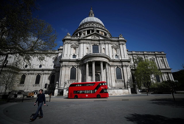 a bus is seen outside of st paul s cathedral london britain april 13 2020 photo reuters