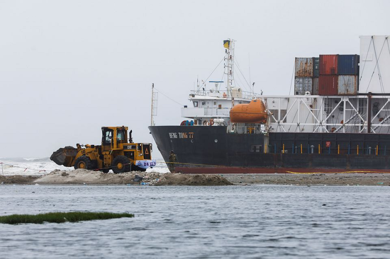 a wheel loader clears the ground near stranded cargo ship mv heng tong 77 at sea view beach in karachi photo reuters