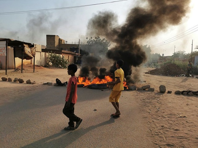 A road barricade is set on fire during what the information ministry calls a military coup in Khartoum, Sudan, October 25, 2021. PHOTO: REUTERS