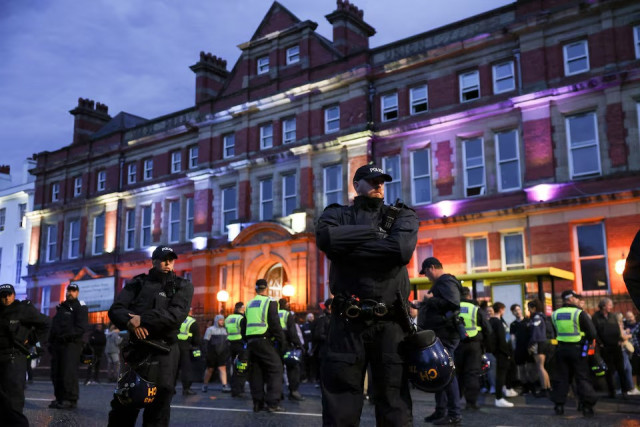 police officers stand guard outside a mosque during a protest in liverpool britain on august 2 2024 photo reuters police officers stand guard outside a mosque during a protest in liverpool britain on august 2 2024 photo reuters