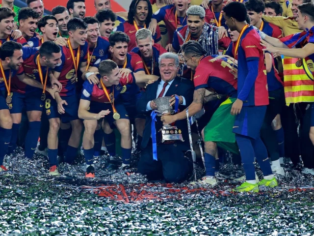 fc barcelona president joan laporta celebrates with the trophy and players after winning the spanish super cup against real madrid at king abdullah sports city jeddah saudi arabia on sunday photo afp fc barcelona president joan laporta celebrates with the trophy and players after winning the spanish super cup against real madrid at king abdullah sports city jeddah saudi arabia on sunday photo afp