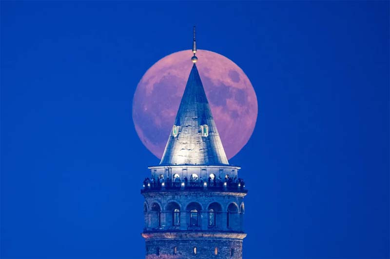 The blue supermoon, the second full moon of a calendar month, rises behind Galata tower in Istanbul. PHOTO: AFP
