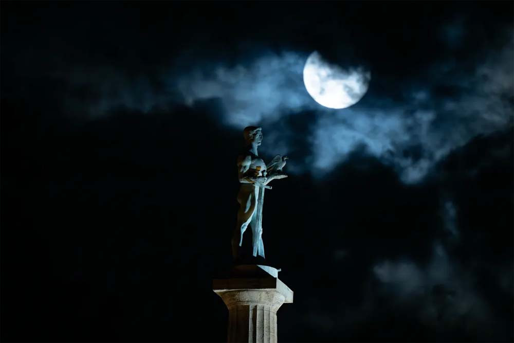 The supermoon rises behind the landmark monument 'The Victor' in Belgrade. PHOTO: AFP