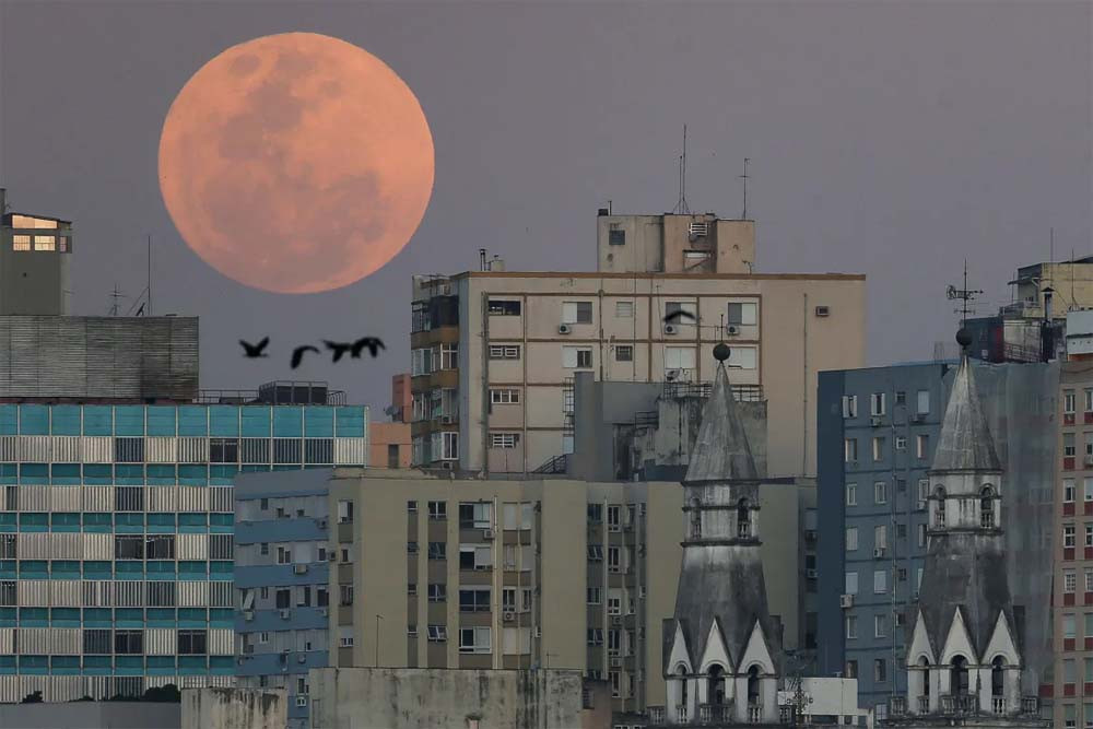 A view shows a full moon over de city of Porto Alegres, Rio Grande do Sul state, Brazil. PHOTO: REUTERS