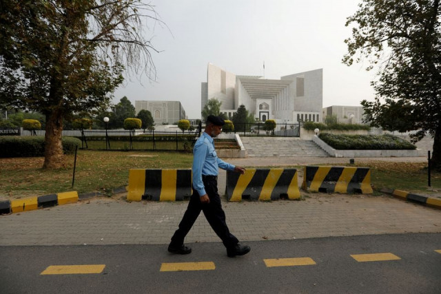 a policeman walks past the supreme court building in islamabad pakistan october 31 2018 photo reuters file a policeman walks past the supreme court building in islamabad pakistan october 31 2018 photo reuters file