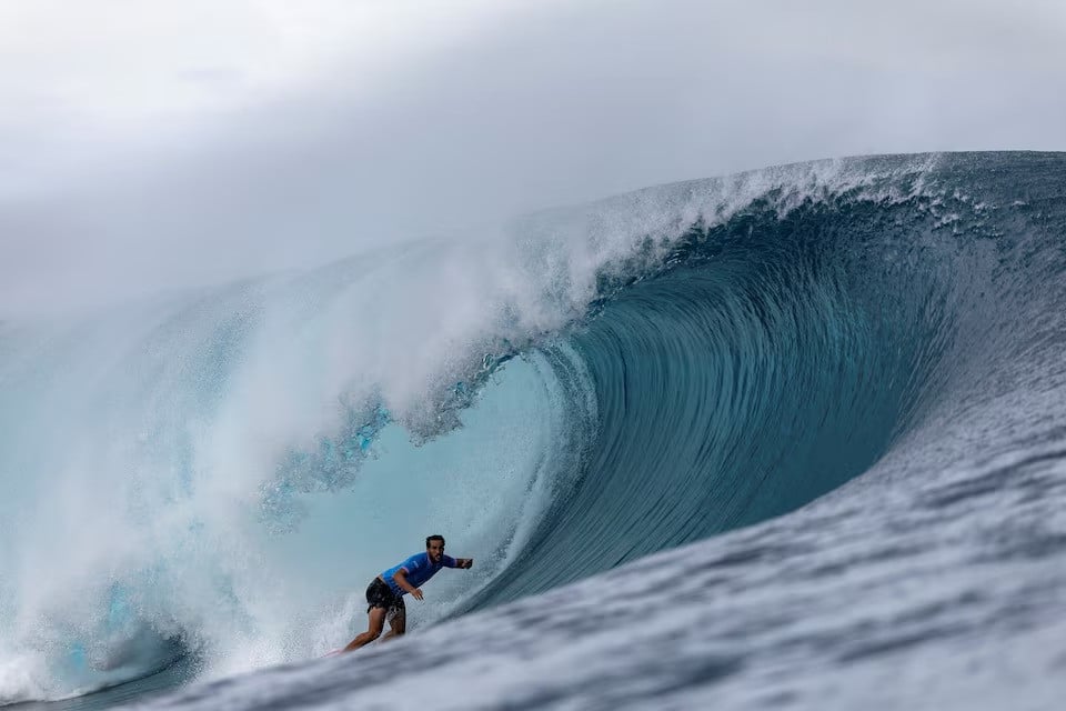 paris 2024 olympics participant ramzi boukhiam of morocco rides a wave during a surfing men s round 3 competition at teahupo o tahiti french polynesia on july 29 2024 file photo reuters