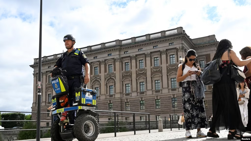 a police officer on a segway patrols sweden s parliament building as the terror threat level in sweden is raised in stockholm aug 17 2023 photo reuters