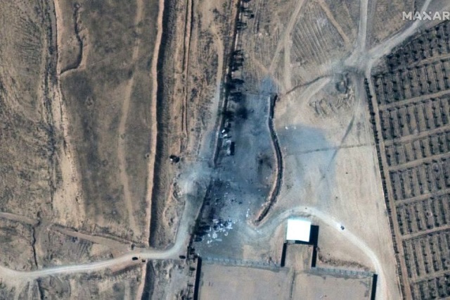 a close up view of destroyed buildings at an iraq syria border crossing after airstrikes seen in this february 26 2021 handout satellite image provided by maxar photo reuters