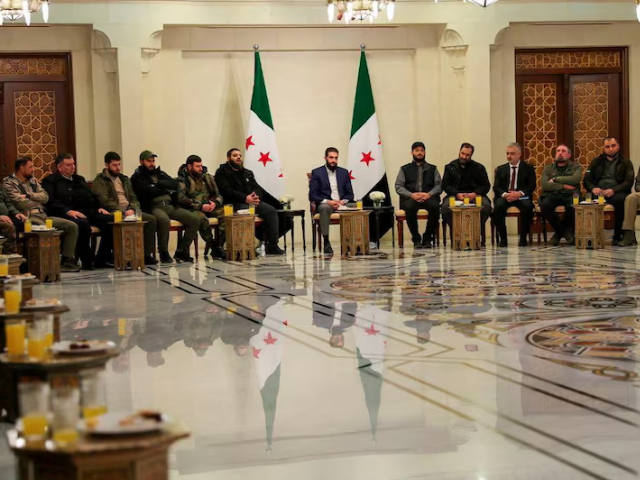 syria s de facto leader ahmed al sharaa attends a meeting with former rebel faction chiefs as he reached an agreement with them to dissolve all groups and consolidate them under the defence ministry according to a statement from the new administration in damascus syria in this handout image photo reuters