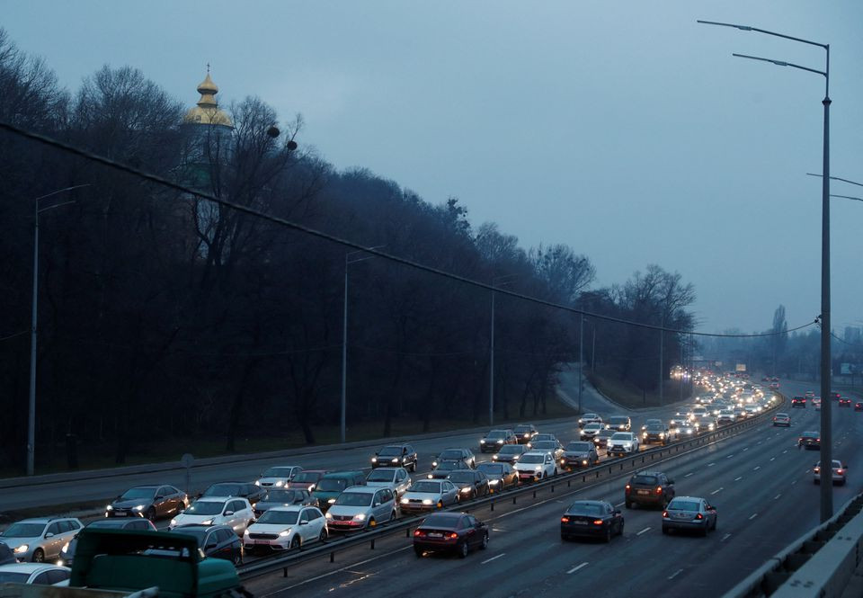 Cars drive towards the exit of the city after Russian President Vladimir Putin authorized a military operation in eastern Ukraine, in Kyiv, Ukraine February 24, 2022. REUTERS