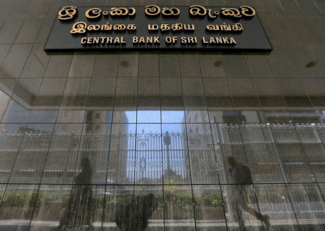 people walk past the main entrance of the sri lanka s central bank in colombo sri lanka march 24 2017 reuters people walk past the main entrance of the sri lanka s central bank in colombo sri lanka march 24 2017 reuters