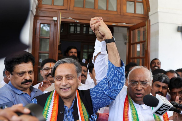 mallikarjun kharge newly elected president of the congress party india s main opposition party raises his hand with party colleague shashi tharoor at kharge s residence in new delhi india october 19 2022 reuters altaf hussain mallikarjun kharge newly elected president of the congress party india s main opposition party raises his hand with party colleague shashi tharoor at kharge s residence in new delhi india october 19 2022 reuters altaf hussain