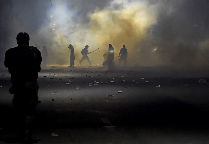 police fire teargas shells on supporters of tlp during a march towards islamabad from lahore on october 22 2021 photo afp