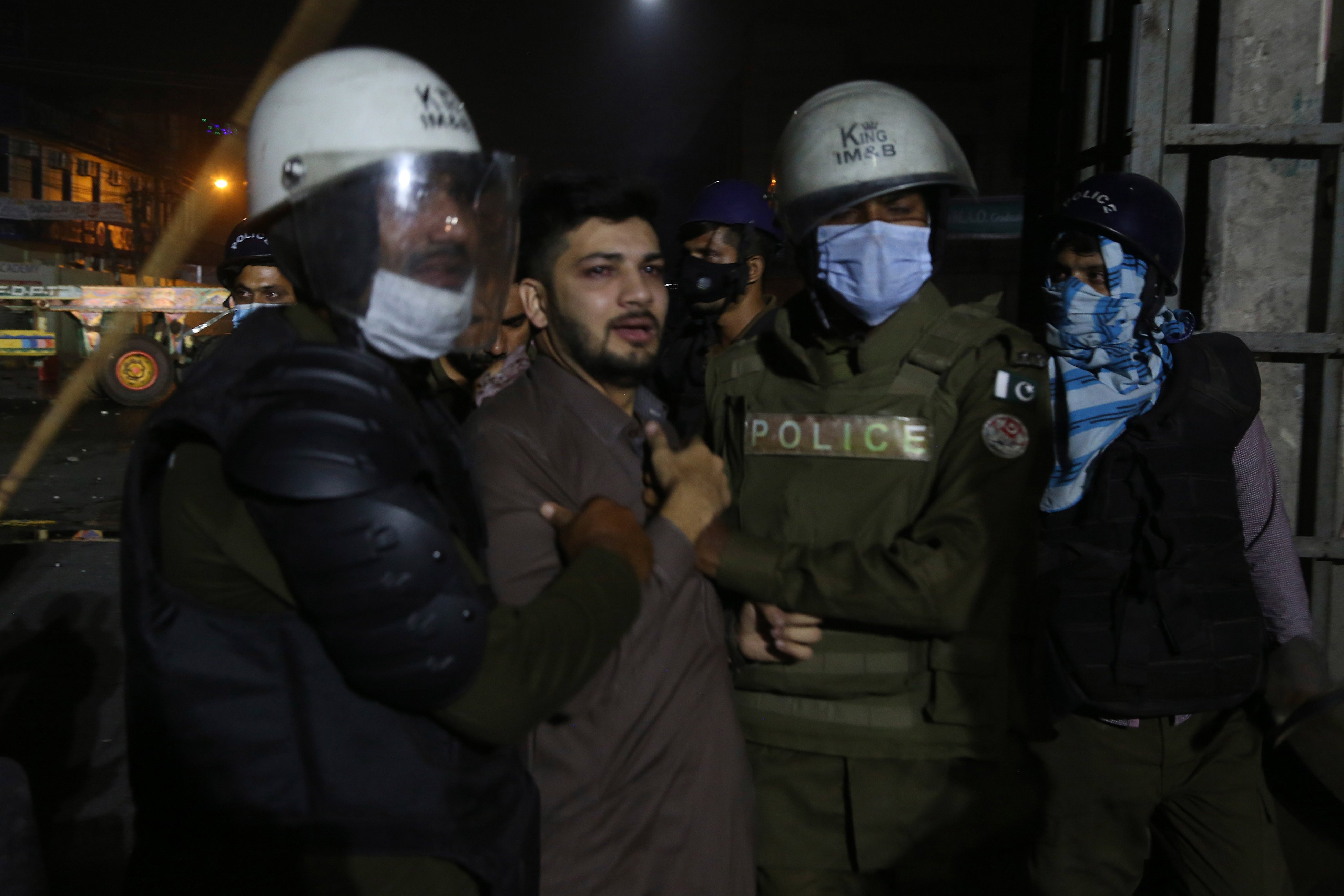 police arrest a tlp worker during the lahore protest on october 22 2021 photo afp