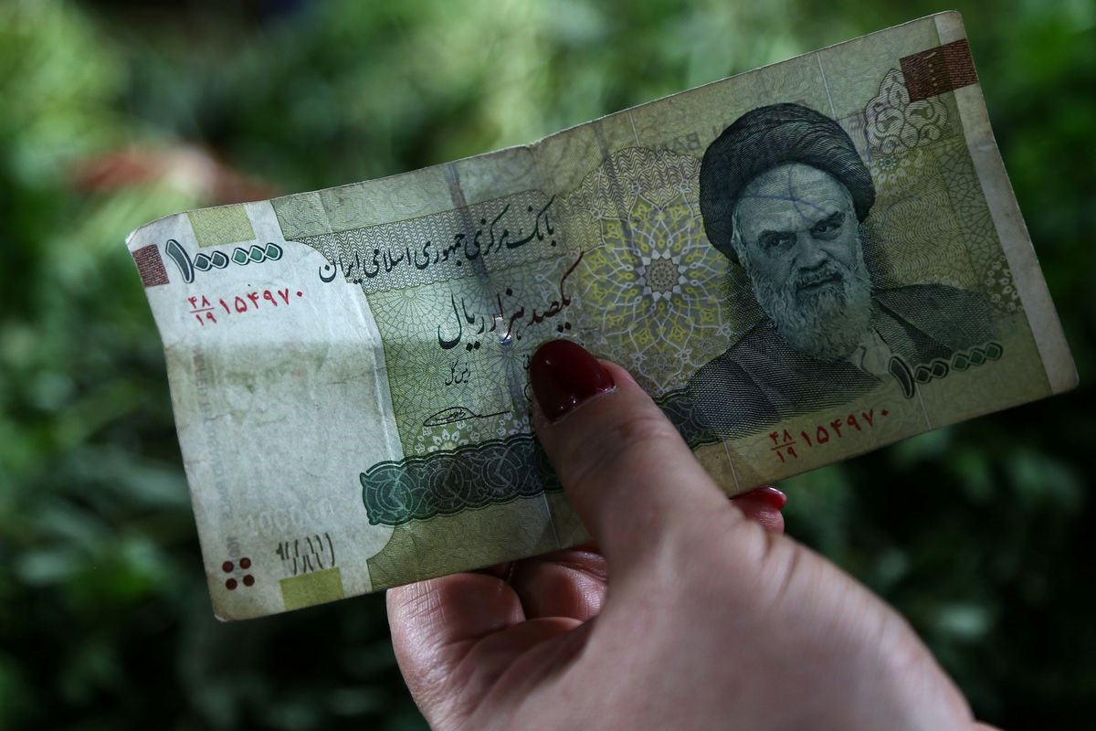 Iranian currency slides to new low amid unrest, isolation