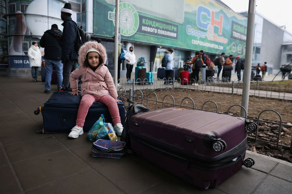 People wait to return to the city at Kyiv Airport after Russian President Vladimir Putin authorized a military operation in eastern Ukraine, February 24, 2022. REUTERS