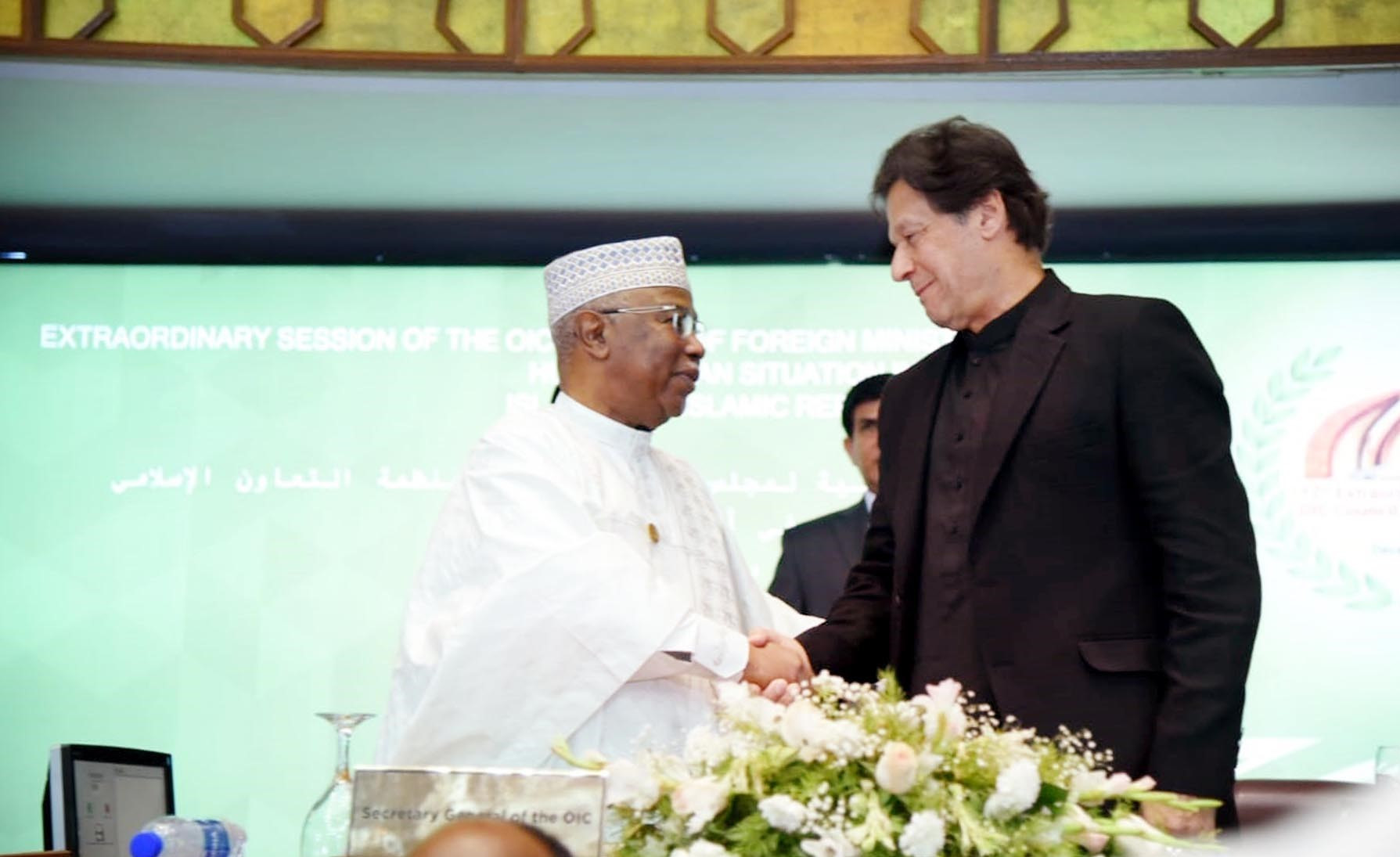 oic chief hissein brahim taha and pm imra khan at the oic moot in islamabad held on dec 19 2021 photo pid