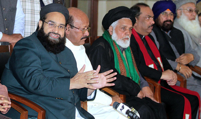 special representative to prime minister on religious affairs tahir ashrafi pictured while addressing a presser following a meeting of leaders of different faiths in lahore on dec 5 2021 photo app