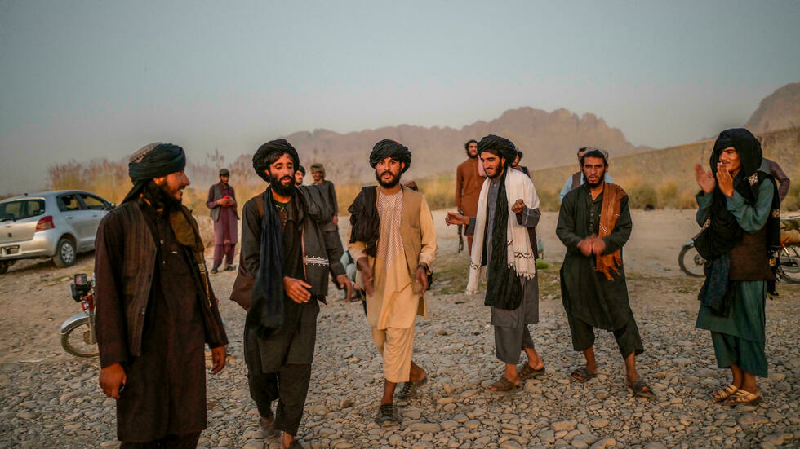 young members of the taliban dance and sing next to a river near kandahar photo afp