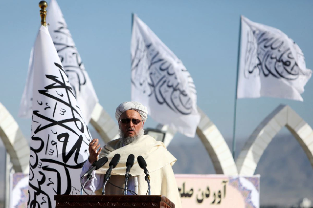 afghan deputy prime minister abdul salam hanafi speaks during a ceremony to raise the taliban flag in kabul afghanistan march 31 2022 photo reuters