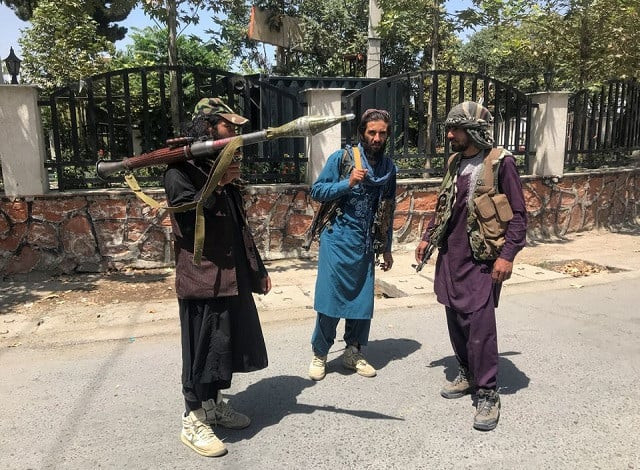 taliban forces stand guard inside kabul afghanistan august 16 2021 photo reuters taliban forces stand guard inside kabul afghanistan august 16 2021 photo reuters