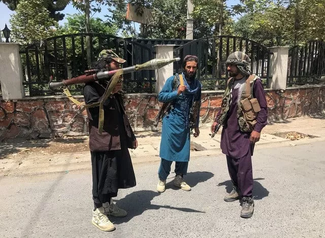 taliban forces stand guard inside kabul afghanistan august 16 2021 photo reuters taliban forces stand guard inside kabul afghanistan august 16 2021 photo reuters
