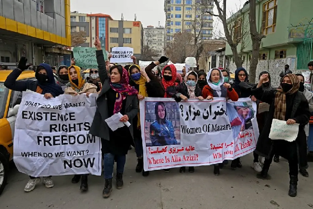 afghan women march as they chant slogans and hold banners during a women s rights protest in kabul on january 16 2022 photo afp