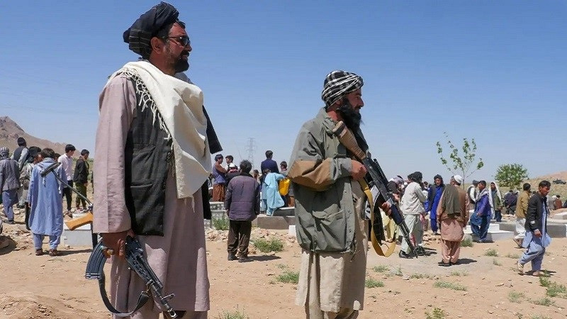 taliban security personnel stand guard at a burial ceremony of the slain after gunmen attacked a mosque on april 30 2024 photo afp