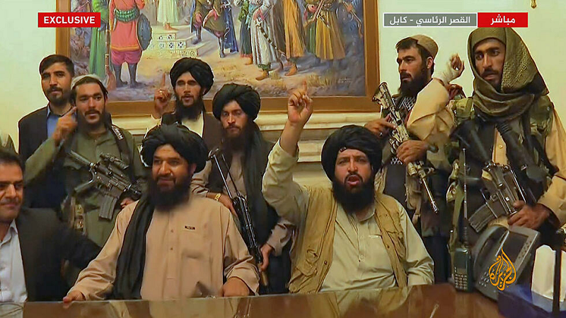 an image grab taken from qatar based al jazeera shows members of taliban taking control of the presidential palace in kabul photo afp