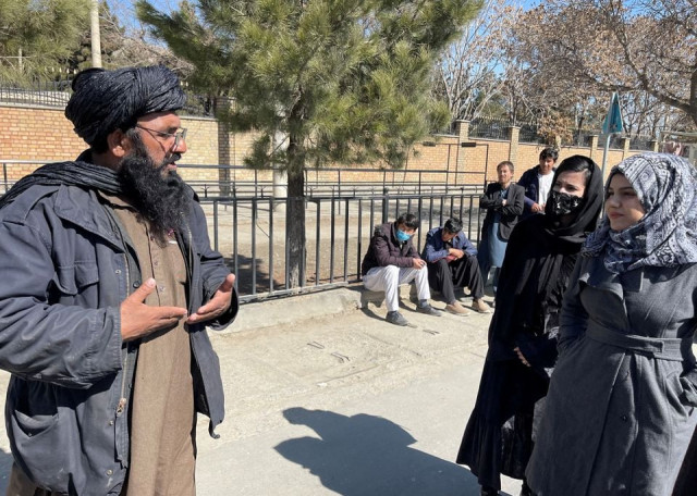 a member of taliban speaks with female students outside the kabul education university in kabul afghanistan february 26 2022 photo reuters a member of taliban speaks with female students outside the kabul education university in kabul afghanistan february 26 2022 photo reuters