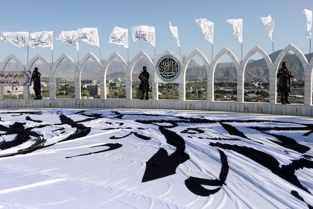 taliban fighters are seen at the taliban flag raising ceremony in kabul afghanistan march 31 2022 photo reuters taliban fighters are seen at the taliban flag raising ceremony in kabul afghanistan march 31 2022 photo reuters