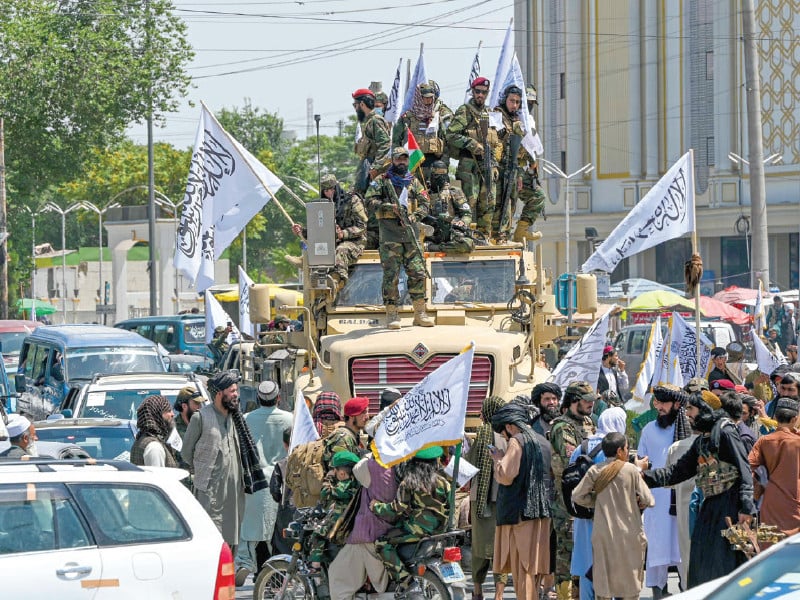 taliban security personnel ride in a convoy in kabul photo afp