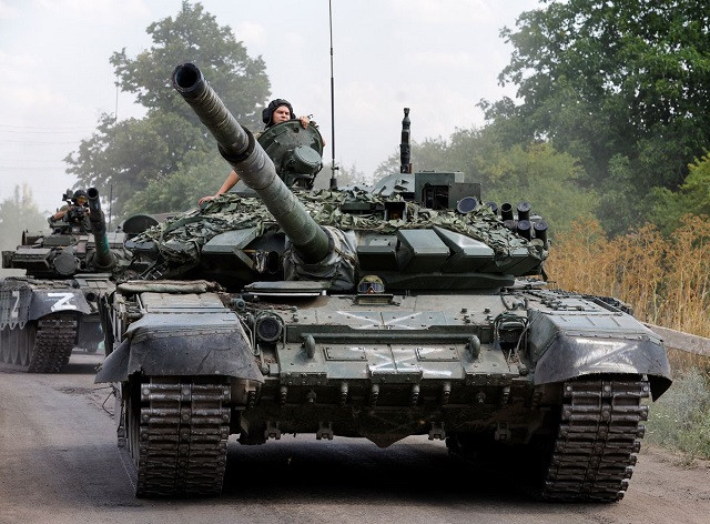 Service members of pro-Russian troops drive tanks in the course of Ukraine-Russia conflict near the settlement of Olenivka in the Donetsk region, Ukraine July 29, 2022. PHOTO: REUTERS