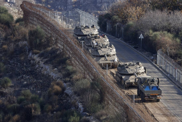 israel says takeover of syria buffer zone limited temporary step israeli tanks take position on the border with syria near the druze village of majdal shams in the israel annexed syrian golan heights on december 8 2024 photo afp israel says takeover of syria buffer zone limited temporary step israeli tanks take position on the border with syria near the druze village of majdal shams in the israel annexed syrian golan heights on december 8 2024 photo afp