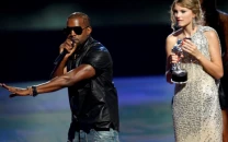 billboard faces backlash for featuring taylor swift s wax figure from ye s famous video