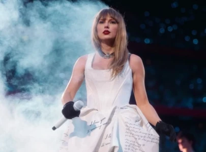 taylor swift shows playful side and shouts out travis kelce at german eras tour show