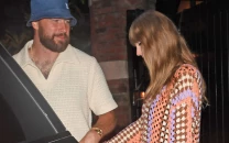 travis kelce tommy hilfiger partnership sparks speculation over wedding outfit