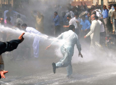 professors and teachers sprayed tear gassed away from cm house during protest professors and teachers sprayed tear gassed away from cm house during protest