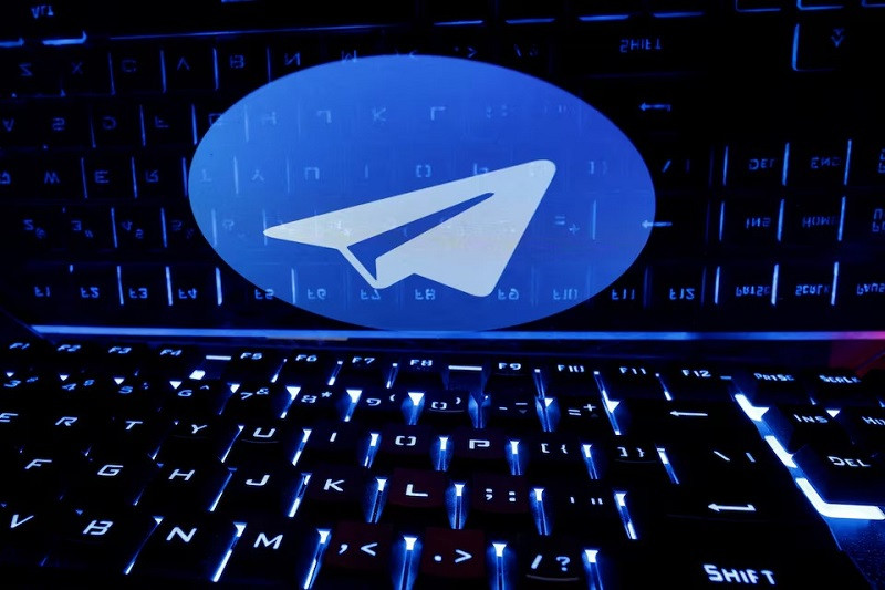 a keyboard is placed in front of a displayed telegram logo in this illustration taken february 21 2023 photo reuters