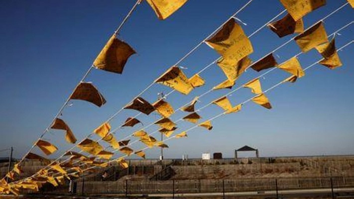 Yellow handkerchiefs bearing messages supporting people in areas hit by the 2011 earthquake and tsunami are hanged at Iwaki 3.11 Memorial and Revitalisation museum ahead of the ten years anniversary of the disaster in Iwaki, Japan, March 10, 2021. PHOTO: REUTERS