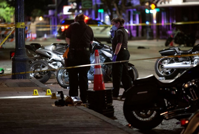 police investigate the scene of a mass shooting in the sixth street entertainment district area of austin texas u s june 12 2021 photo reuters police investigate the scene of a mass shooting in the sixth street entertainment district area of austin texas u s june 12 2021 photo reuters