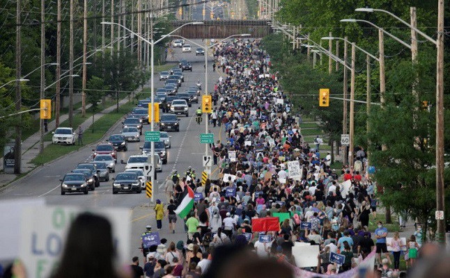 people march the 7km from a crime scene to a mosque in memory of a muslim family that was killed in what police call a hate motivated attack in london ontario canada june 11 2021 photo reuters