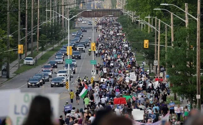 people march the 7km from a crime scene to a mosque in memory of a muslim family that was killed in what police call a hate motivated attack in london ontario canada june 11 2021 photo reuters people march the 7km from a crime scene to a mosque in memory of a muslim family that was killed in what police call a hate motivated attack in london ontario canada june 11 2021 photo reuters